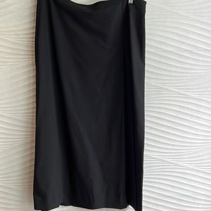 COS black skirt with front side pleating and back split. European size 44.